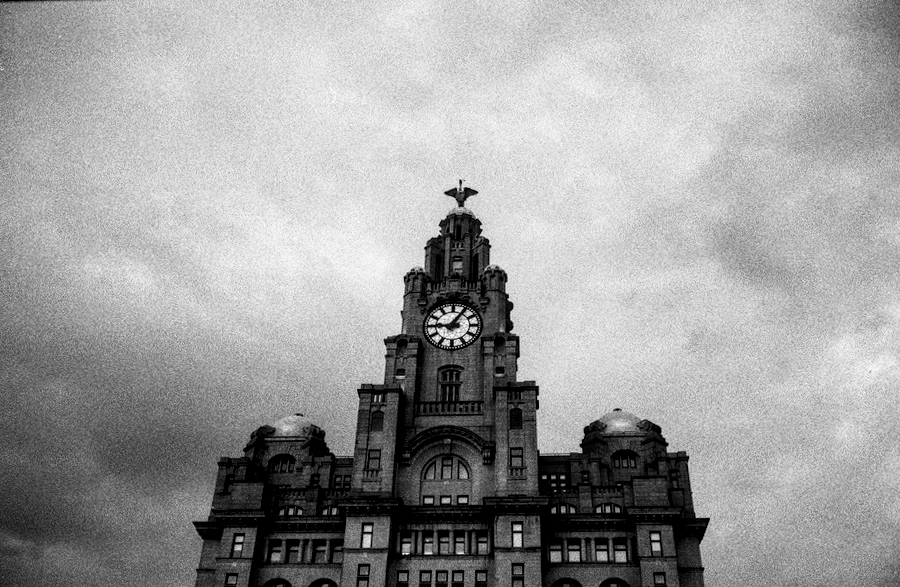 A black and white photo of the Liverpool Liver Building